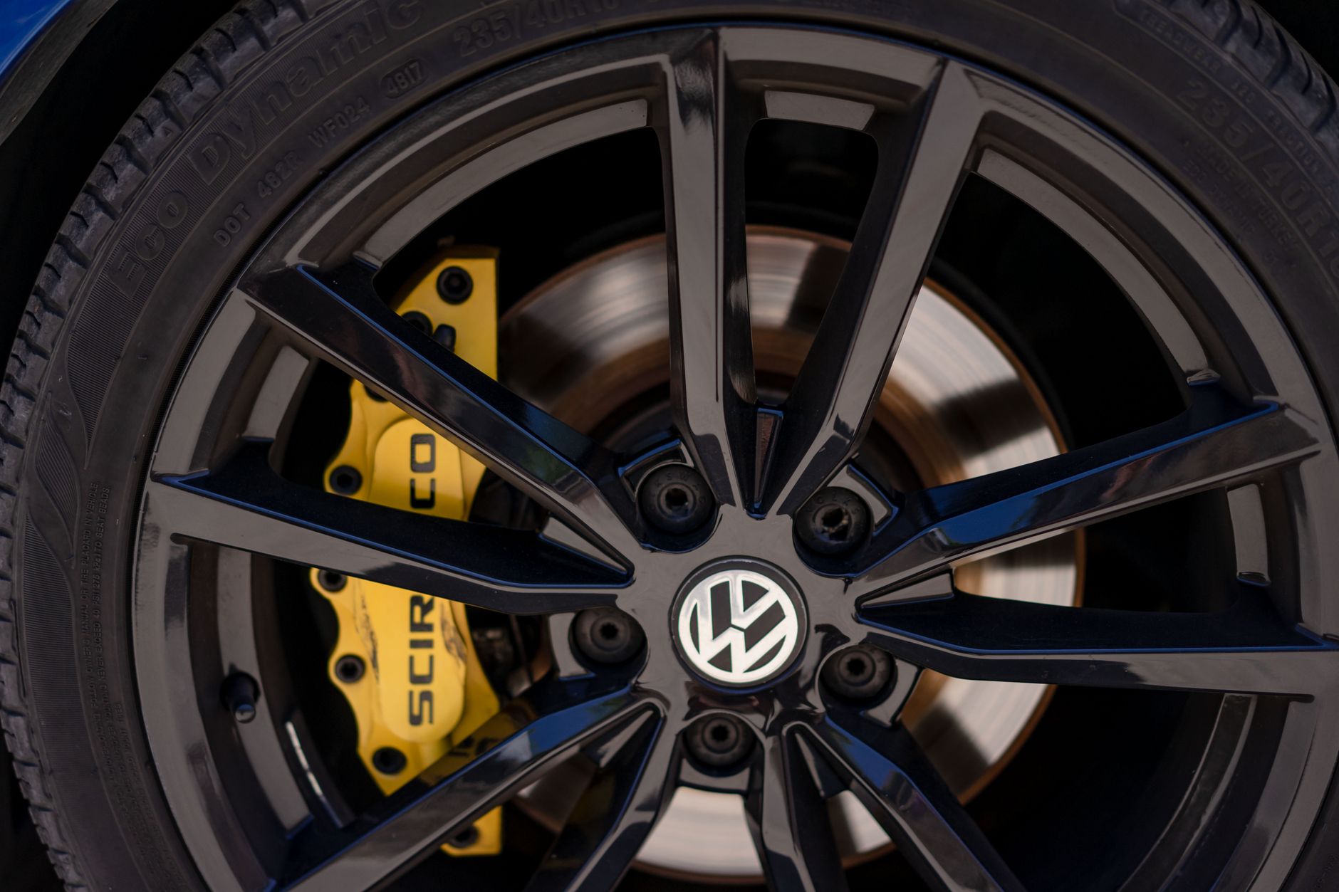 a black volkswagen rim in close up shot
